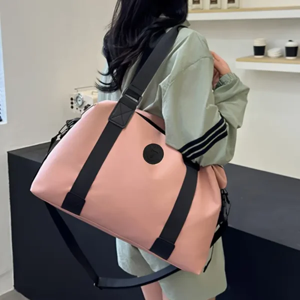 Versatile Pink Nylon Travel Bag with Black Accents - Image 6